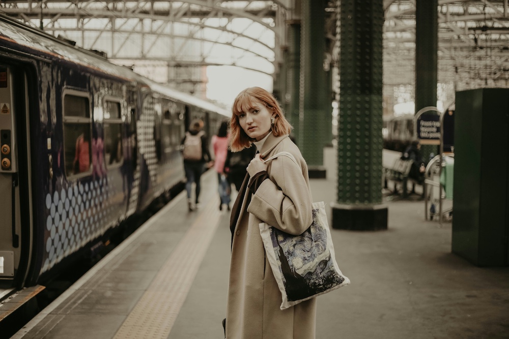 Woman standing on train station platform